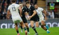 New Zealand's fly-half Beauden Barrett runs with the ball.