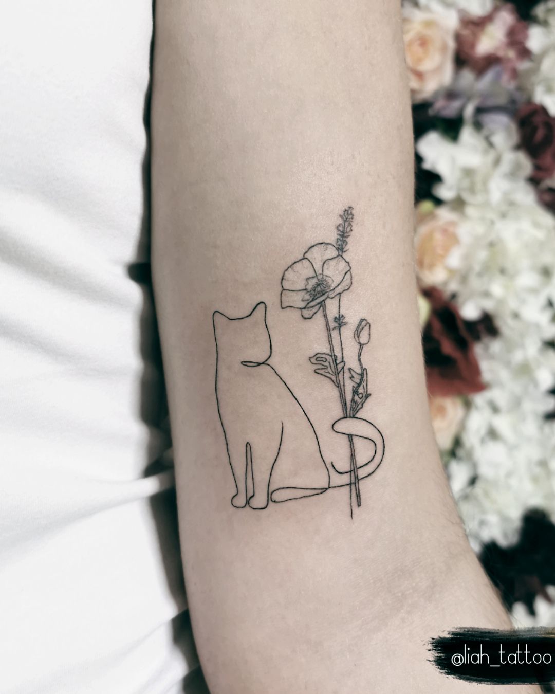 Cute Cat Tattoo With Flowers / Done By @Liah_Tattoo / One Liner Art /  Fineline Tattoo | Kitten Tattoo, Cat Tattoo Designs, Cat Outline Tattoo