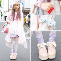 Merumo's pretty lilac hair with a braid caught our eye on the street in Harajuku. Her pastel look features mostly resale pieces with Nile Perch tights and ribbon-laced Tokyo Bopper platform shoes. -TokyoFashon