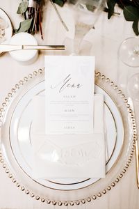 Classic white and gold charger and place setting with gold foil caligraphed menu | Kindred Weddings & Events