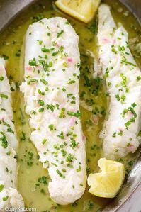 Make an unforgettable seafood dinner with this easy butter poached fish recipe. Enjoy tender, flaky fish perfectly cooked with butter, lemon, shallots, and fresh herbs. Low carb and keto friendly. #seafoodrecipes #poached #fish #butter #ketorecipes #lowcarbrecipes #lowcarbketorecipes