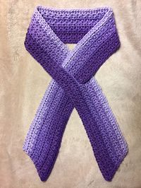 This is a beautiful textured awareness ribbon key hole scarf that works up pretty fast. The finished size is 52 x 3 1/2”. Approximately 150 yards of worsted weight yarn. This can be made in any color to suit the awareness ribbon you are supporting. Happy hooking!