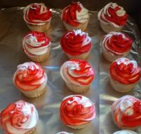 Cupcakes made for a wedding with peppermint frosting - red and white swirled frosting on top