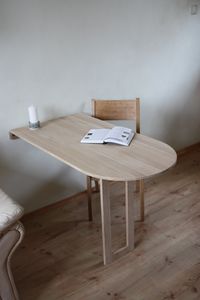 "This semicircular murphy table in solid oak is a perfect solution if there is not much space in your kitchen, living room or any other room. If it is time to drink your coffee - drop it down, you don't need a table anymore - raise it up. It is suitable to work with your computer, do your homework, do some hand work, it also can be turned into additional working area in the kitchen and so on. A STURDY WALL IS NECESSARY IN ORDER TO SECURE THE TABLE. This table measurements are: 25,6'' length on t