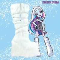 Abbey Bominable Frost is a presale item. It is expected to ship in Mid-November. Please note that this estimated time frame is subject to change without notice.  White vegan fur upper White lace up detail Icicle and Snowflake charms White vegan fur wrapped EVA bottom White rubber outsole Back zipper closure 3 inch plat