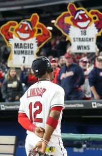 Cleveland Indians fans celebrate the Indians win as Francisco Lindor is interviewed by ESPN after the Indians won their 18th victory in a row beating the Baltimore Orioles 3-2 at Progressive Field, Cleveland, Ohio, on September 10, 2017. (Chuck Crow/The Plain Dealer).