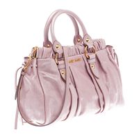 TOP HANDLE    Shiny calf top handle bag with laces on front  Gathering on top part and laces on sides  Polished brass hardware  Detachable shoulder strap  Snap closure  Inside pocket with zipper  Metal lettering logo on outside  Cotton satin lining  Strap length: 98 cm    L13.8" H8.7" D4.7"