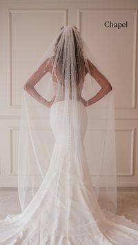 The Hailey Veil is a true statement piece that’s both modern and chic. This veil is dripping with countless pearls, giving the illusion of floating pearl drops. The pearls on this veil are securely studded onto the tulle and are steamer friendly. The Hailey Veil has raw edges to seamlessly drape over the train of your dress. Secured with a heavy-duty silver comb, you can’t go wrong with this stylish and flirty veil. Details: Tulle Color: Bright white, light ivory, creamy ivory. Please view our t