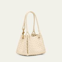 Bottega Veneta "Adiamo" parachute top handle bag in intrecciato leather  Shoulder straps with metal knot hardware  Open top with magnetic closure  Approx. 6.5"H x 8.3"W x 6.7"D Made in Italy