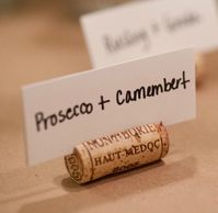 DIY Wine Cork Place Card Holders - great use for all those wine corks you've been saving.  Use to label wine and food pairings at a tasting party or dishes on a buffet.