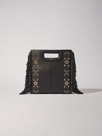 Maje's iconic M bag comes in plain leather accentuated with bi-colour eyelets. Featuring fringe detailing on the sides and a sheathed handle, it has an embossed gold-tone logo and a signature engraved on the buckles. It comes with a practical magnetic fastening and an adjustable, removable shoulder strap so you can carry it in a variety of ways: by hand, on the shoulder or crossbody.  Plain leather M bag   Fringes  Bi-colour eyelets   Adjustable and removable shoulder strap: 81cm   Dimensions: 26 x 20 x 7cm  - Black - Maje - Woman