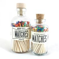 Vintage apothecary-inspired bottles and colored matches – decorate your home with style and functionality.  Features 80 three and a half-inch matches with rainbow tips Size: 5.75" x 2.5” Strike on bottle Cork bottle topper Proudly designed and produced in Hays, KS  #matchesinajar #matchesaesthetic #matchespackaging #woodenmatches