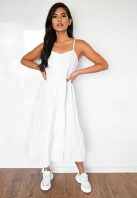 white strappy cami tiered midi dress featuring adjustable straps and a covered button front.    regular fit    Midi - Sits just below the knee    100% Polyamide    Pilar wears a UK size 8 / EU size 36 / US size 4 and her height is 5'9"