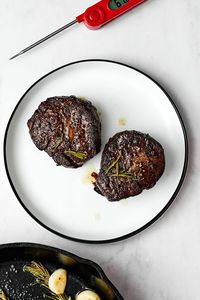 Make dinner at home a bit more special with this foolproof filet mignon recipe! It starts by pan searing in a cast iron skillet and finished in the oven for juicy and tender results.