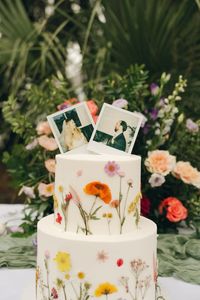 Floral designed with polaroids wedding cake