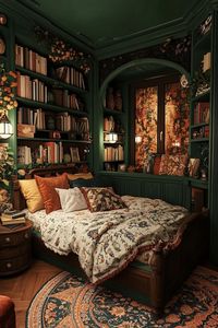 Cozy bedroom with rich green walls, bookshelves, and a patterned rug. Get ready for a whimsical journey through dark cottagecore interiors where quaint charm meets mysterious, cozy nooks that might just inspire your next favorite hideaway.