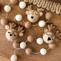 These super cute reindeer garlands are the perfect decoration for your home this season. Why not hang on your fire mantel piece, under a shelf or on a peg rail to add a touch of winter magic to your home. To complete the look why not match with our Reindeer Stems here and Hanging Deers here. Available Sizes: Small 150cm - 3 Deer heads / 16 Felt Balls Medium 200cm - 4 Deer Heads / 20 Felts Balls Large 250cm - 5 Deer Heads / 24 Felt Balls Each felt shape is handmade using 100% New Zealand Wool. Co