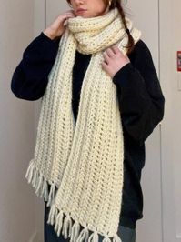 "This lovely handmade piece is one of the coziest scarves you will ever wrap yourself up in! With a length of 8 feet, you can wear this scarf in a ton of different ways. Made of a chunky wool blend yarn, this scarf will keep you super warm on the coldest of winter days. Complete with decorative tassels at each end, this scarf is not only practical but absolutely adorable.  Measurements: 96\"L x 9\"W 80% Acrylic, 20% Wool  If you would like to commission a similar scarf in any other color or leng