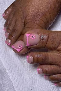 Elevate your pedicure with toe nails donning pretty pink French tips by @humbliztic_nailz, complemented by delicate flower nail art featuring rhinestones for an elegant and feminine touch. Ready to step up your toe nail game? Dive into Nailustrous for 25 Toe Nail Design Ideas and elevate your pedicure style today!