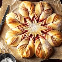 Christmas Star Twisted Bread Recipe -This gorgeous sweet bread swirled with jam may look tricky, but it’s not. The best part is opening the oven to find this star-shaped beauty in all its glory. —Darlene Brenden, Salem, Oregon