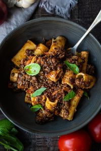 Rich and robust, this plant-based Lentil Bolognese is hearty, "meaty" and full of depth of flavor. Toss it with your favorite pasta, or spoon it over creamy polenta- either way, this simple nourishing vegan meal is one the whole family will enjoy.