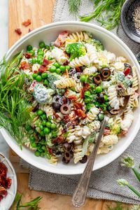 When you want a classic tasting deliciously creamy pasta salad, but you’re hoping to skip the excess calories, turn to this blue ribbon recipe! This healthy pasta salad is made with loads of fresh vegetables and a zippy Greek yogurt dressing that has just enough mayo in it to make the pasta salad taste just like the higher fat and calorie versions everyone knows and love. Plus I've added in a few flavor boosts to make it taste worthy of a first-place prize in the recipe contest!