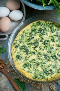 This Crustless Spinach Quiche recipe uses feta cheese and is reminiscent of the flavors in Spanakopita. This easy quiche doesn't have a crust and is naturally low-carb, gluten-free, diabetic, Atkins and keto-friendly. #ketorecipe #lowcarbrecipe #quiche