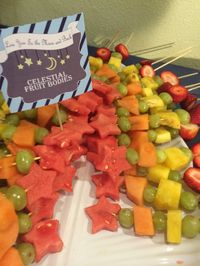 "Celestial fruit bodies" love you to the moon and back baby shower theme. Star shaped fruit skewers.