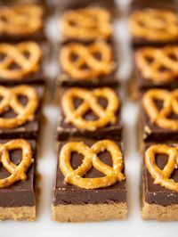 These no-bake pretzel peanut butter bars are a ridiculously simple homemade version of your favorite peanut butter cups! BudgetBytes.com