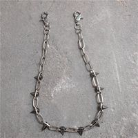 Spiked Wallet Chain A spiked chain link belt with clasps at each end, which can be worn as a wallet chain or a necklace. Length: 25.2"/64cm. Material: Stainless Steel/Alloy.