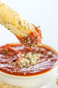 A copycat recipe for Pizza Hut breadsticks, made from scratch. Chewy, buttery, loaded with seasonings and an easy dipping sauce!  Does anyone else have the same nostalgic soft spot that I do for Pizza