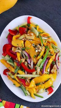 · 5 servings  Light, refreshing, and flavorful, this Spicy Thai Mango Salad is made with fresh flavors of Mango, cucumber, red bell peppers, onions, Cilantro, and mint tossed in a flavorful spicy, sweet, and savory dressing! It is made in less than 30 minutes and is a delicious accompaniment to any Thai dish.  For salad  • 3 Mangos thinly sliced (Unripe and firm. I have used Atulfo. You can use Haden, Kent, or whatever is available where you live)  • 1 large red bell pepper thinly sliced  • 1 english cucumber thinly sliced  • ½ cup red onion thinly sliced.  • ½ cup cilantro finely chopped  • ¼ cup mint finely chopped  • ½ cup roasted cashews roughly chopped  For dressing  • 2 to 3 tablespoon chili oil (homemade or store-bought) Use according to your spice level  • 2 tablespoon lemon juice