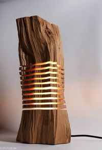 This floor lamp, as an illuminated sculpture, reveals the elemental form and grain in a piece of reclaimed California Incense Cedar. Fascinating details and hidden beauty are revealed from the light emitting from the center of the sculpture, flowing out from each individual slice suspended on a thin aluminum armature. The warm light traces the contours of the wood capturing beautiful patterns from all angles. #lamp #lighting #cedar #woodworking #designfurniture #california #floorlamp #idlights