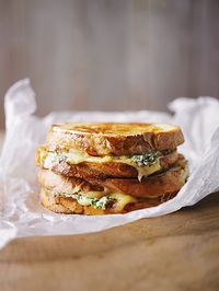 For this recipe, we took a classic grilled (read: fried) sandwich and made it even better by stuffing it with soft cheese, chillies and garlic. You won't go back to a normal grilled cheese once you've tasted this.