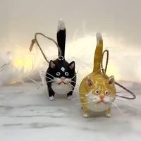 whimsical miniature kitty figurine. Hand sculpted and hand painted. Each one is unique and cute!