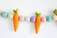 These wool felted eggs and carrots are the perfect natural Easter or farmhouse decoration.  Carrots are 3 inches long, felt balls are 1 inch in diameter.   Pieces slide on the string and stay where they are placed.  Length listed is when pieces are spaced every 3 inches.   Colors: Blush, Patel Mint, Lilac, Pale Yellow, Robin's Egg, Apricot Need to hang a garland right away?  Don't forget to add the Garland Essentials Pack to your order: https://etsy.me/3zG7mij