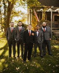 Our groomsmen wore charcoal suits with “Cinnamon” ties to match the bridesmaid gowns while the groom wore a black suit and cinnamon tie Photos by @eighteighteenphotography #groomsmen #fallwedding #groomsmensuits #groomsmenoutfits #groomsmeninspiration #octoberwedding