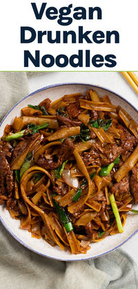 Savory, spicy, and a little sweet, these Vegan Drunken Noodles are the ultimate Thai-inspired dish. These noodles are packed with so much flavor and yet they only take 20 minutes to make! Try it for an easy vegan dinner recipe. Easy vegan recipes | vegetarian recipes | vegan dinner ideas | vegan dinner recipes | 20 minute vegan recipes | fast vegan recipes