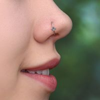 Simple and very elegant Surgical Steel nose ring with CZ stone. This simple and beautiful piece of jewelry is perfect for a variety of outfits and occasions. The listing is for ONE ring. This item does not contain nickel. --- C u s t o m i z i n g --- The nose ring can be made with the following gemstones: Garnet, Blue Opal, White Opal, Turquoise, Red Ruby, Lapis, Red CZ, Green CZ, Blue CZ, Pink CZ, Clear CZ. Please select one during checkout process. Your nose ring can be made in the following