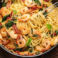 This delicious creamy sun dried tomato shrimp pasta comes together in about 45 minutes, is easy to make, and always gets rave reviews!