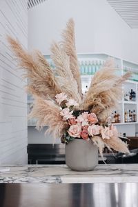 www.sirbotanical.com  a pampas grass and rose bar arrangement. This is one of our MOST POPULAR arrangements, and we can tell why. pampas grass is super fashionable at the moment and we aren't mad about it!