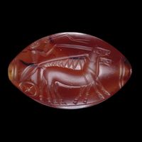 Carnelian seal w/a man driving a chariot, Minoan, 1450-1300 BC. Knossos