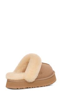 This comfy, water-resistant suede slipper is trimmed and lined with genuine shearling. 1 1/2" platform (size 9) Water-resistant Slight dye transfer may occur with darker colors during first few wears Genuine-shearling upper and lining/synthetic sole Shearling may be sourced from Australia, Ireland, Spain, the UK or the USA. See packaging for confirmed country of origin Imported Women's Shoes