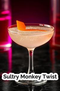 Indulge in the enticing flavors and alluring aroma of the Sultry Monkey Twist cocktail. This delicious blend of gin, orange juice, and Grenadine, with a hint of absinthe, is the perfect way to elevate your evening. #CocktailRecipe #Mixology #GinCocktail