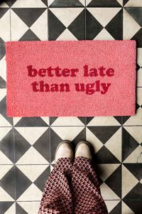 Make a great first (or last) impression with the Better Late Than Ugly Pink Doormat. Perfect for those who are always running late, the coconut coir doormat adds tongue-in-cheek style to the entrance of your home and ensures that you never take yourself too seriously. Bold and beautiful in a pink and red palette, the indoor doormat also introduces a pop of colour to your front door. A great gift idea, the Better Late Than Ugly Pink Doormat makes a fabulous new home present for the friend who is always running at least thirty minutes late but arrives looking effortlessly glam. A chic alternative to plain doormats, the design of this candy pink doormat is almost too pretty to get dirty...- Pink coconut fibre doormat - Measures: H41cm x W70cm - Includes a non-slip base - Avoid continuous expo