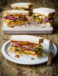 A classic coronation sarnie taken up a notch. Spices, garlic and ginger bump up the flavour, along with tangy pickled onions and crunchy poppadoms