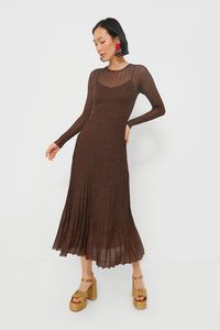 Moon River is an L.A.-based apparel company that makes easy, trendy pieces for day or night.Meet the Brown Long Sleeve Maxi Dress, a chic blend of comfort and sophistication! Crafted from luxe fabric with metallic sheen, the full sleeves and round neck provide a cozy feel, making it ideal for fall and winter occasions. Whether you’re attending a dinner party or a brunch with your gals, this dress pairs perfectly with ankle boots and statement earrings for a polished, on-trend look that effortles