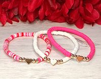 These Valentine bracelets are made with dainty 4mm Heishi beads and 14K Gold plated brass beads and a 14K Gold plated heart, strung on strong stretchy cord. These bracelets are fun and lightweight. Wear it alone or stack together with other bracelets! Perfect for Valentine's Day! Get one for that someone special or treat yourself!