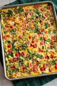 Easy Sheet Pan Eggs are oven baked eggs made with a variety of mix-ins of choice including cheese, meat, and vegetables. They're great for breakfast sandwiches and make ahead breakfast.