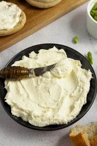 Make this easy homemade cream cheese to spread on bagels, dip veggies in, or add to recipes, like a classic cream cheese frosting. With just three simple ingredients, you'll never have to buy the store-bought version again. #FarmhouseonBoone #homemadecreamcheese